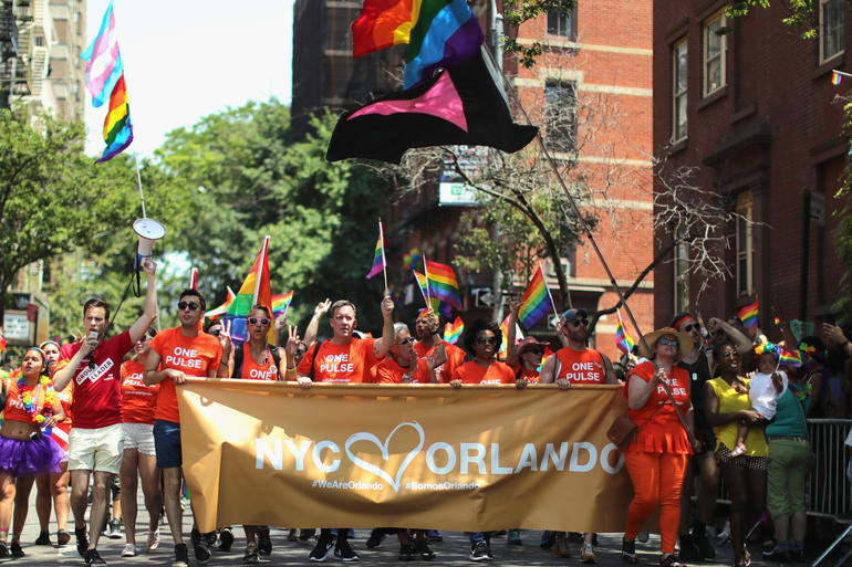 NEW YORK, NY - JUNE 26: A view of marchers with a tribute to Orlando sign during the New York City Pride 2016 march on June 26, 2016 in New York City. (Photo by Neilson Barnard/Getty Images)